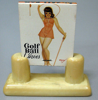 Bakelite Catalin match book holder with a mint book of pin up art matches USA