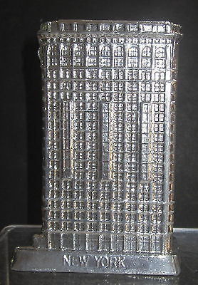 Flat Iron building with a aluminum finish all metal  made in the USA